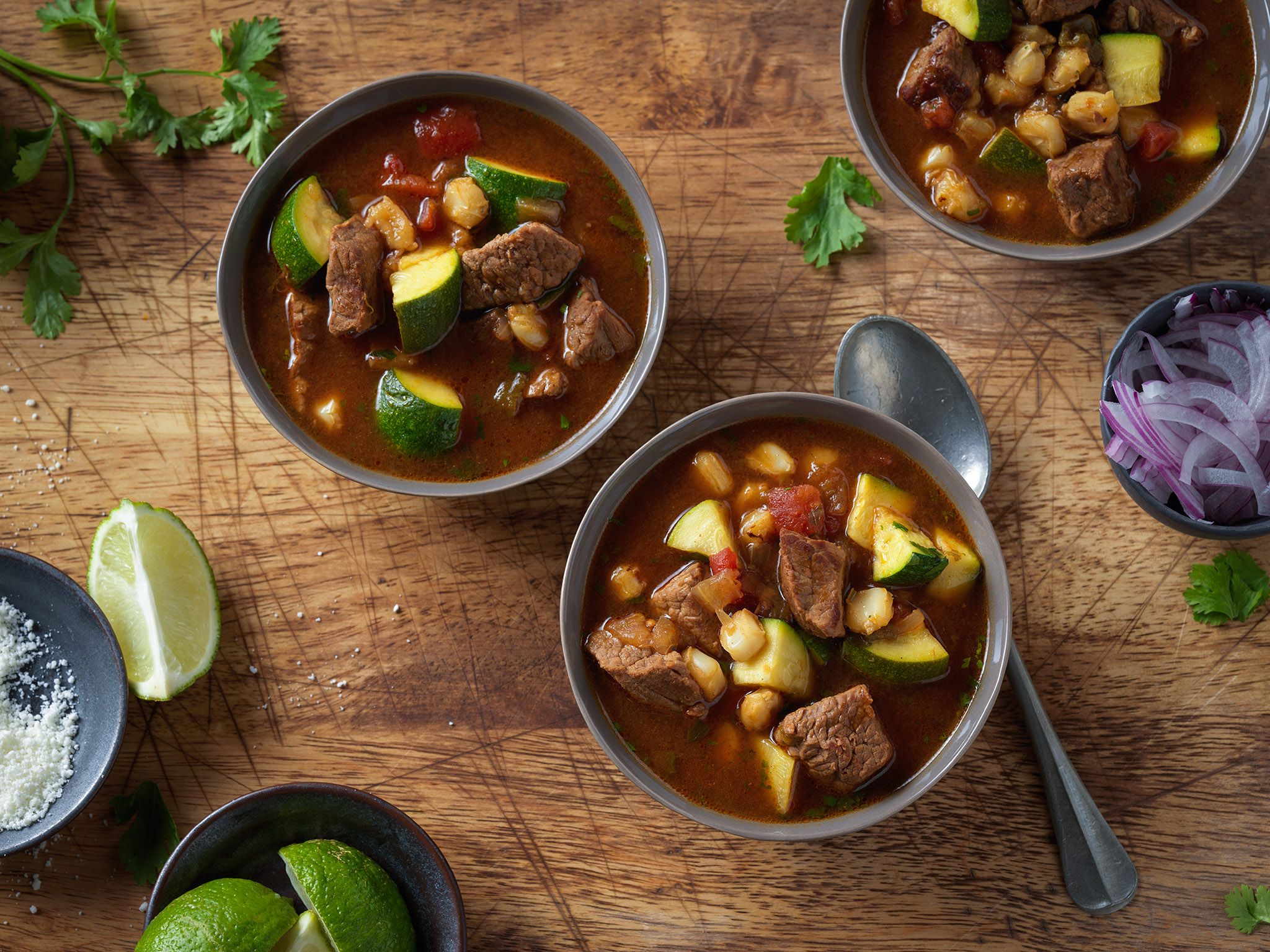 Ancho chili peppers, angus beef, and hominy in our Birria-Inspired Bee, Beef Soup