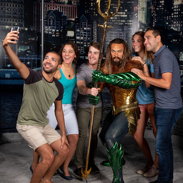 Group posing with Aquaman at Madame Tussauds Orlando