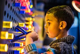 A boy in a Wonder Zone at WonderWorks Orlando.