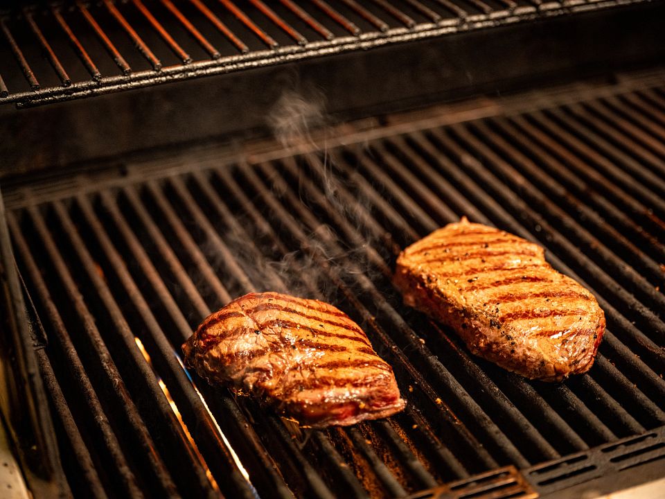 Two Steaks On Grill Angled_BDIA