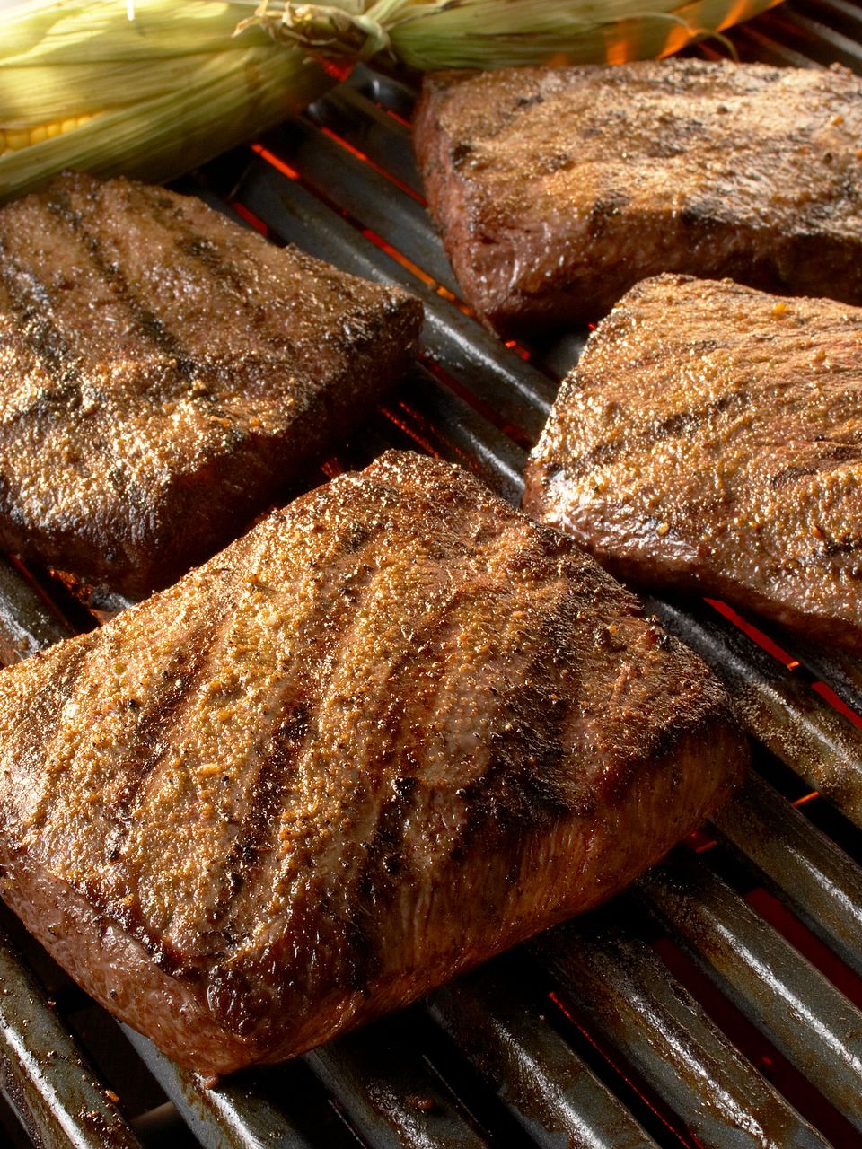 Flat Iron Steaks with Grilled Corn and Cumin-Lime Butter