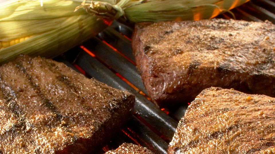 Flat Iron Steaks with Grilled Corn and Cumin-Lime Butter