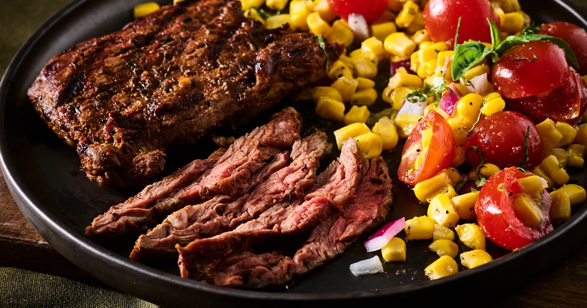 Cowboy Marinated Skirt Steak with Corn Salad | Beef Loving Texans | Beef Loving Texans is your one-stop information center for beef recipes, cooking techniques and real life stories. Lean more about beef today. Brought to you by the Texas Beef Council.