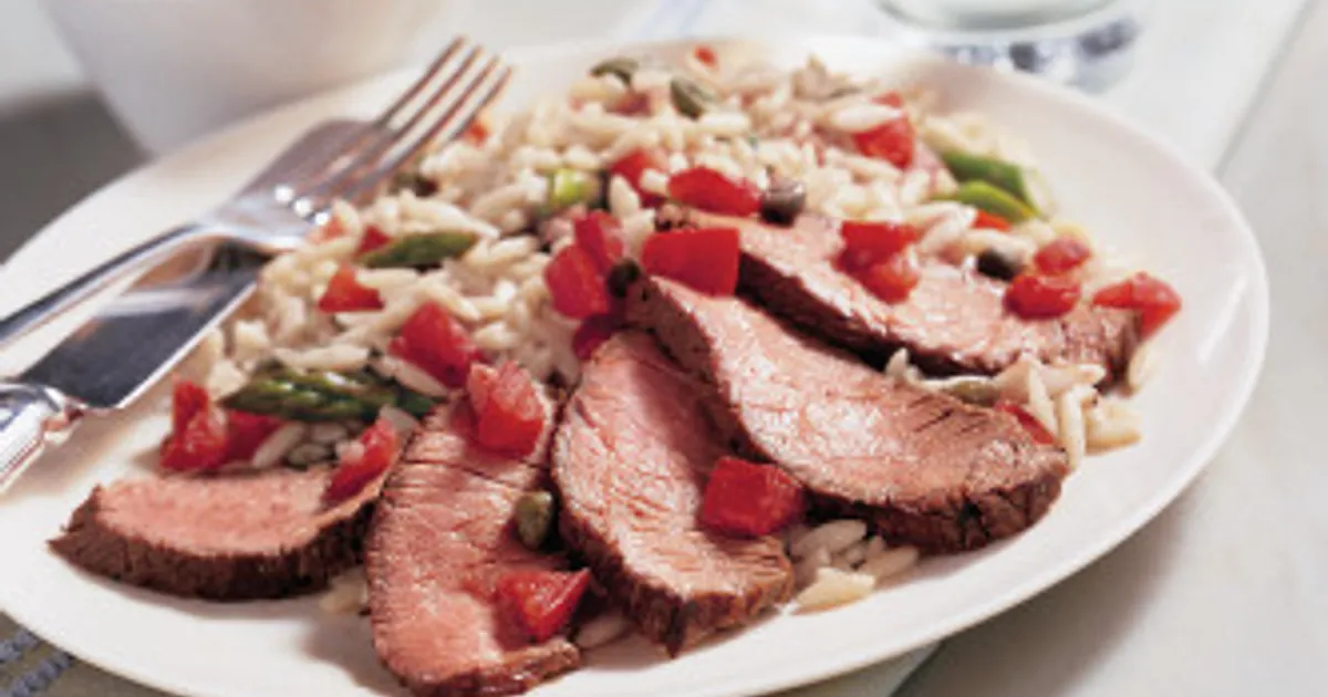 Beef Top Sirloin Steak with Asparagus &amp; Tomato Orzo | Beef Loving Texans | Beef Loving Texans is your one-stop information center for beef recipes, cooking techniques and real life stories. Lean more about beef today. Brought to you by the Texas Beef Council.