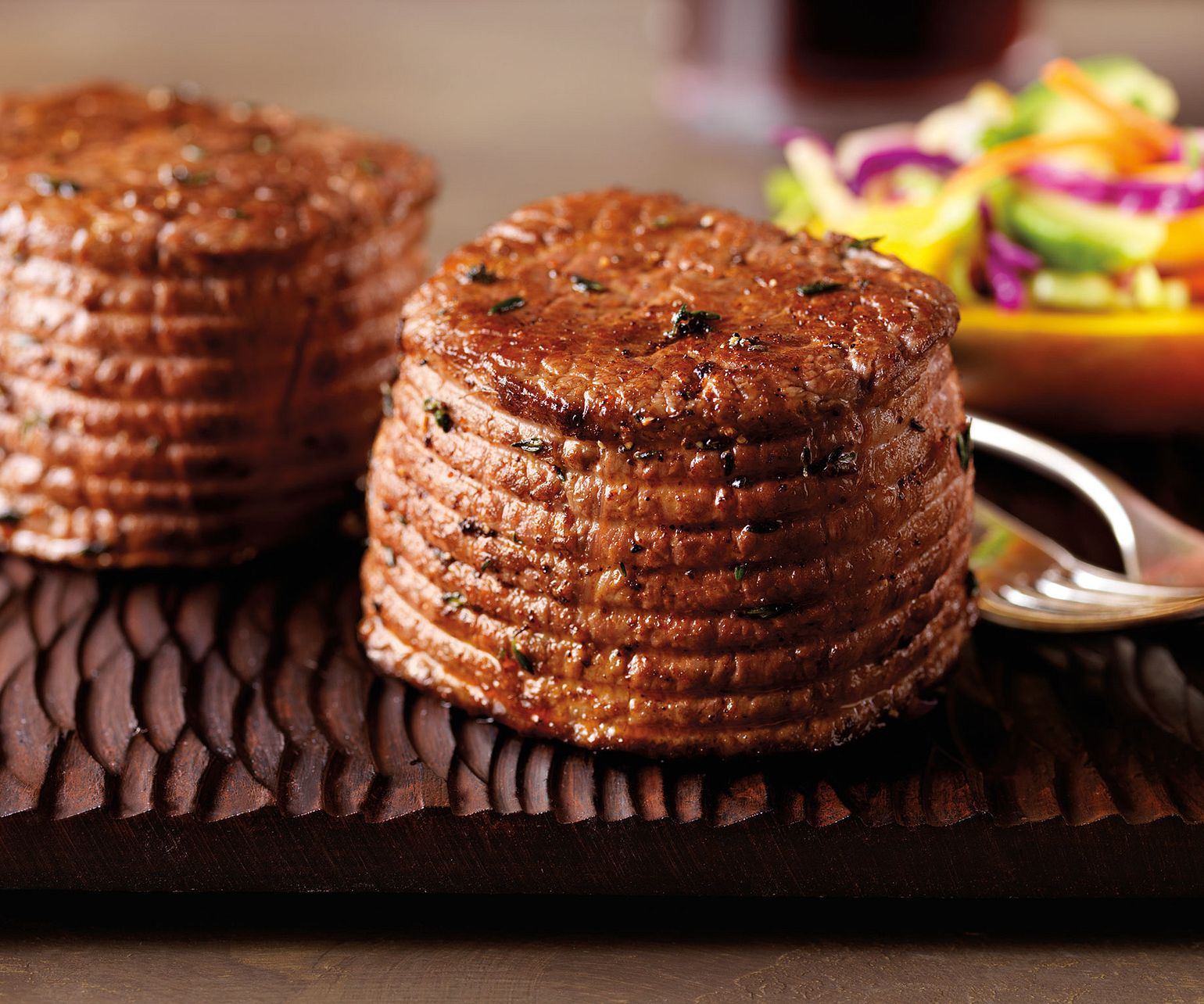 Pepper-Ancho Rubbed Ribeye Filets with Mango Slaw