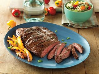 Flank Steak benefits from a tenderizing marinade of balsamic vinegar, basil, Dijon mustard and garlic.