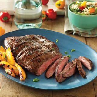 Flank Steak benefits from a tenderizing marinade of balsamic vinegar, basil, Dijon mustard and garlic.