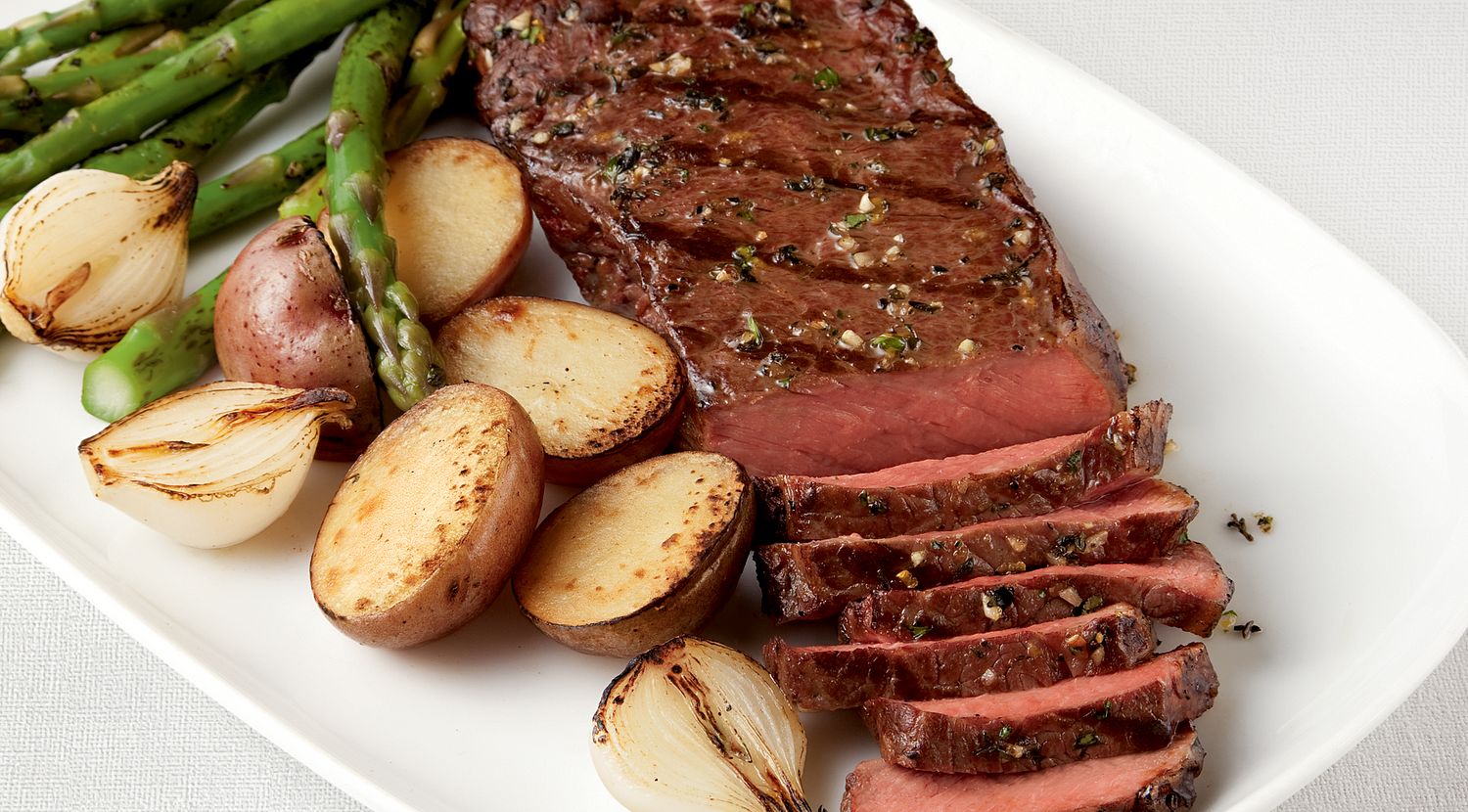 Tender Pepper-Rubbed Strip Steaks with Grilled Vegetable Trio | Beef