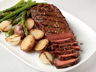 Tender Pepper-Rubbed Strip Steaks with Grilled Vegetable Trio