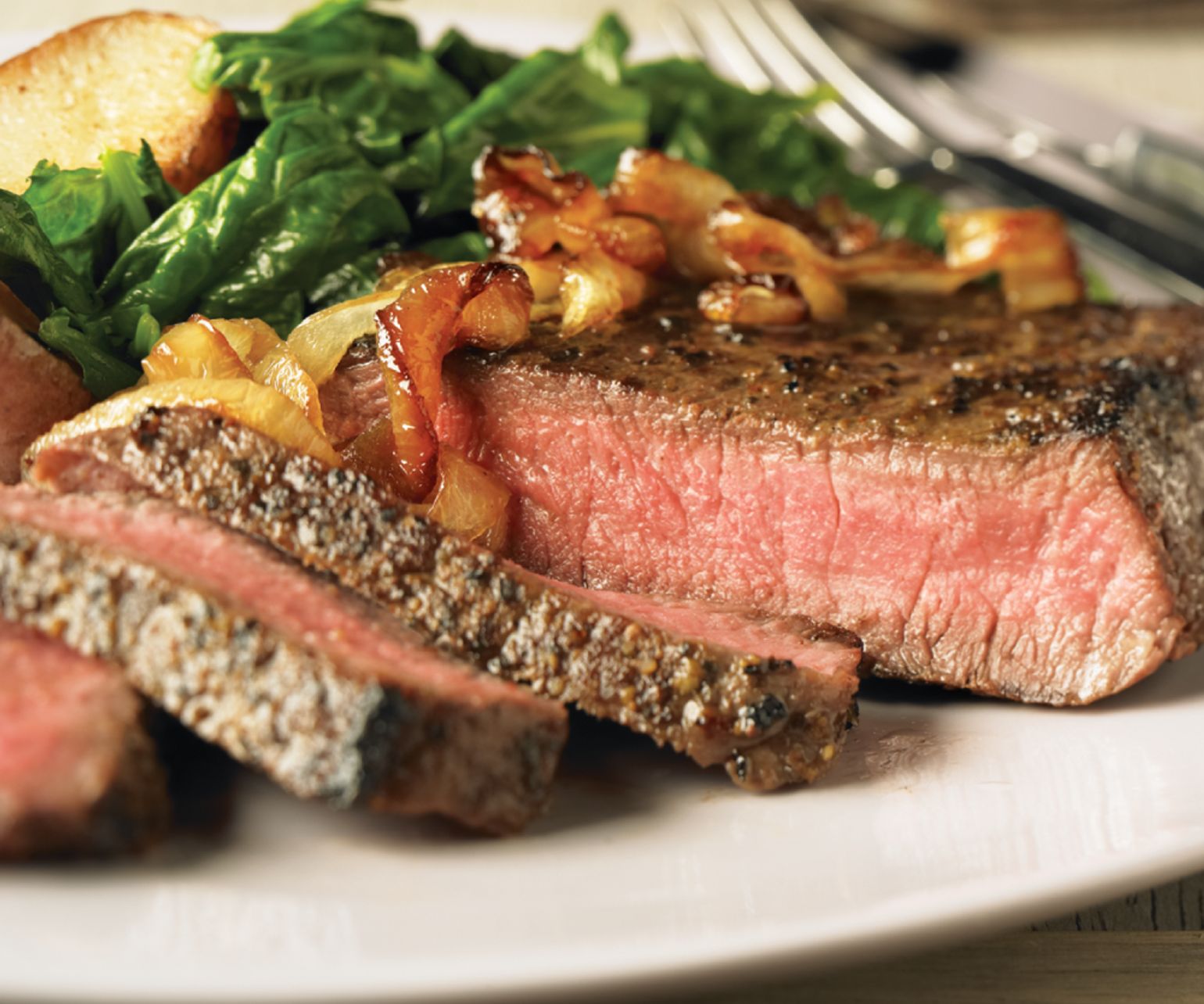 Peppered Steaks with Caramelized Onions