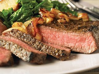 Peppered Beef Steaks with Caramelized Onions