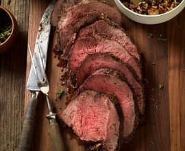 Thyme-Rubbed Beef Sirloin Tip Roast with Roasted Onion and Pear Wild Rice