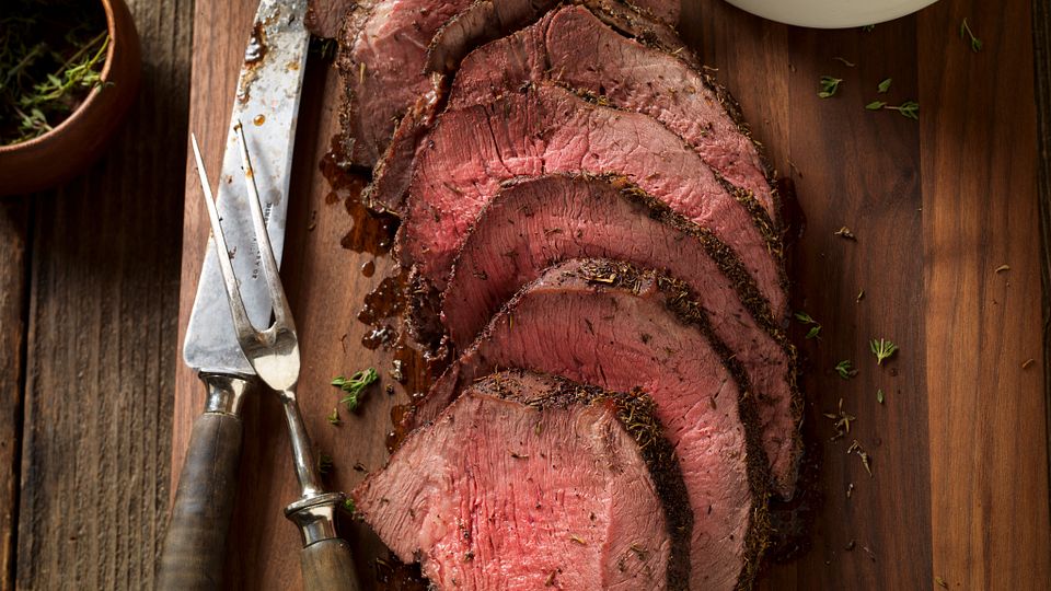 Thyme-Rubbed Beef Sirloin Tip Roast with Roasted Onion and Pear Wild Rice