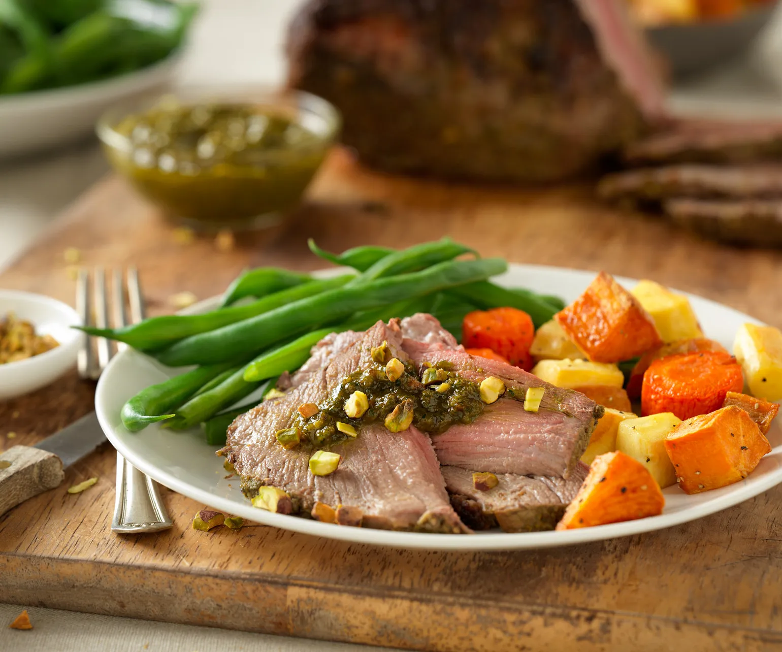Herb-Crusted Beef Roast with Pistachio-Leek Pesto