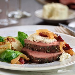 Tenderloin Roast with Wine-Braised Onions and Herb Cheese
