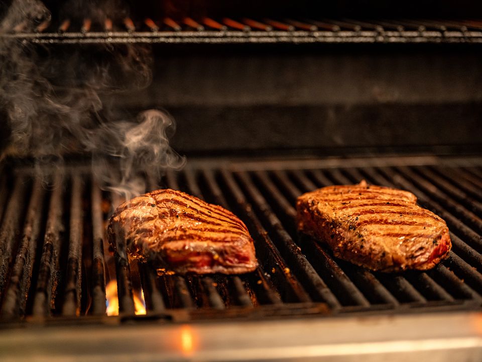 Two Steaks On Grill Angled_BDIA