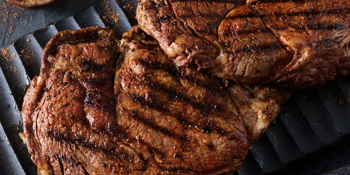 ribeye steaks on the grill