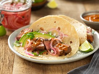 Grilled Adobo Beef Steak Tacos with Creamy Chipotle Salsa and Tequila Pickled Red Onions