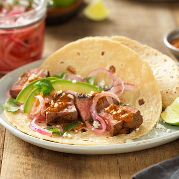 Grilled Adobo Beef Steak Tacos with Creamy Chipotle Salsa and Tequila Pickled Red Onions