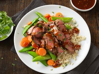 steak with rice and bbq sauce