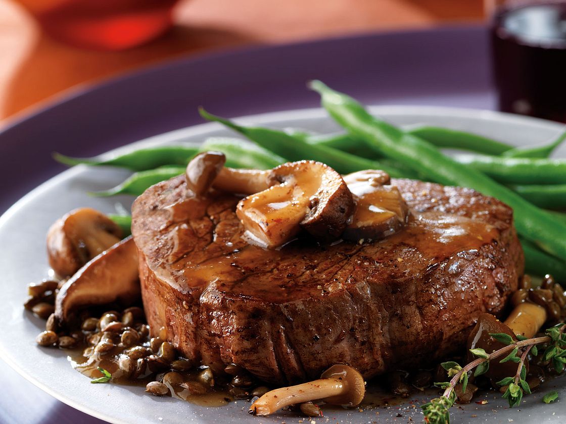 Filet Mignon With Herb Butter Sauce And Mushrooms