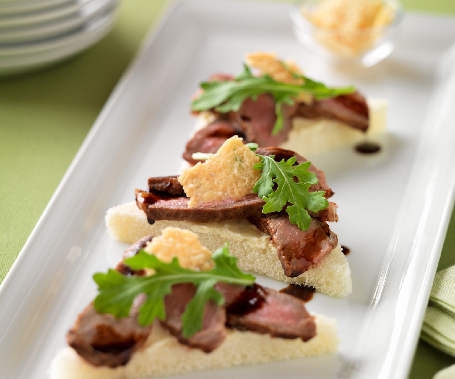 Beef Crostini with Parmesan Crisps and Balsamic Drizzle