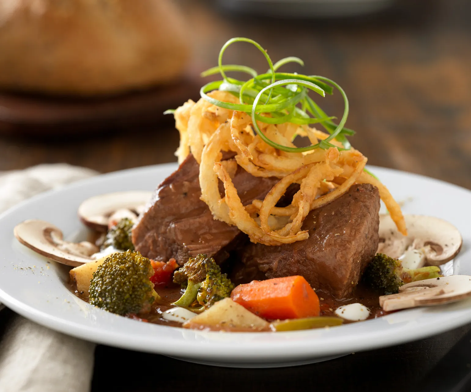 Slow-Cooked Beef Pot Roast Soup with Roasted Vegetables and Lemon Crema