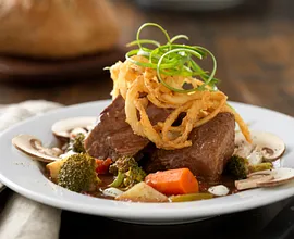 Slow-Cooked Beef Pot Roast Soup with Roasted Vegetables and Lemon Crema