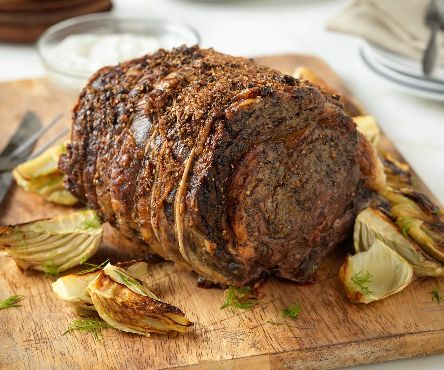 Herb-Crusted Beef Rib Roast with Roasted Fennel and Horseradish Cream Sauce