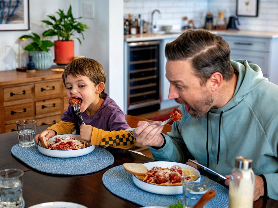 Dad and Kid Eating Meatballs 4_BDIA