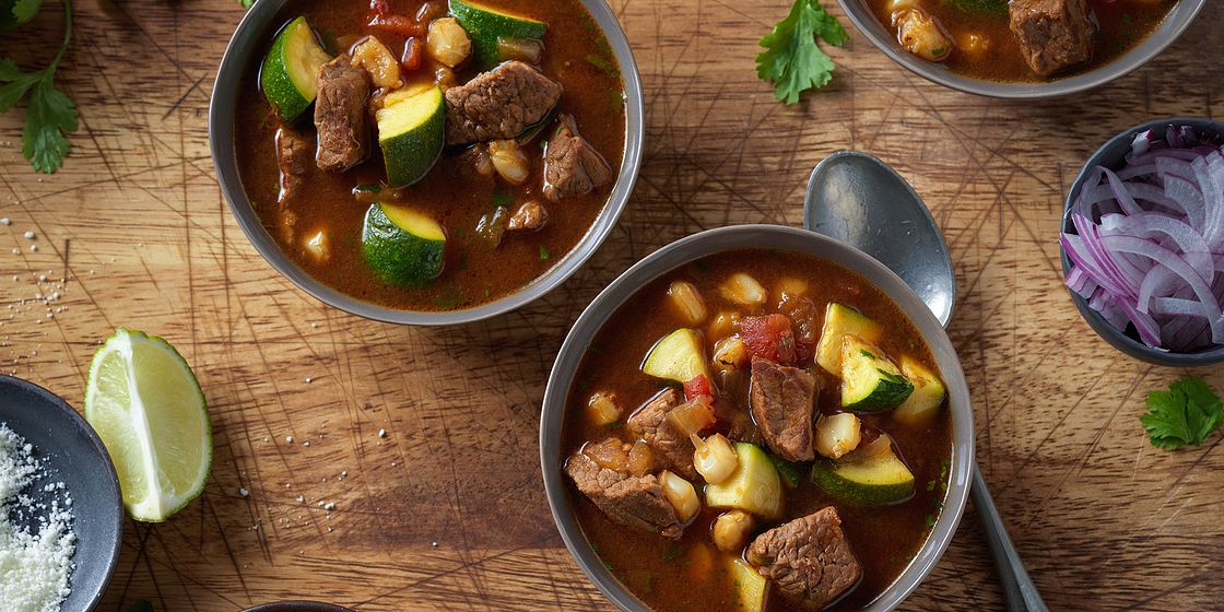 Ancho chili peppers, angus beef, and hominy in our Birria-Inspired Bee, Beef Soup