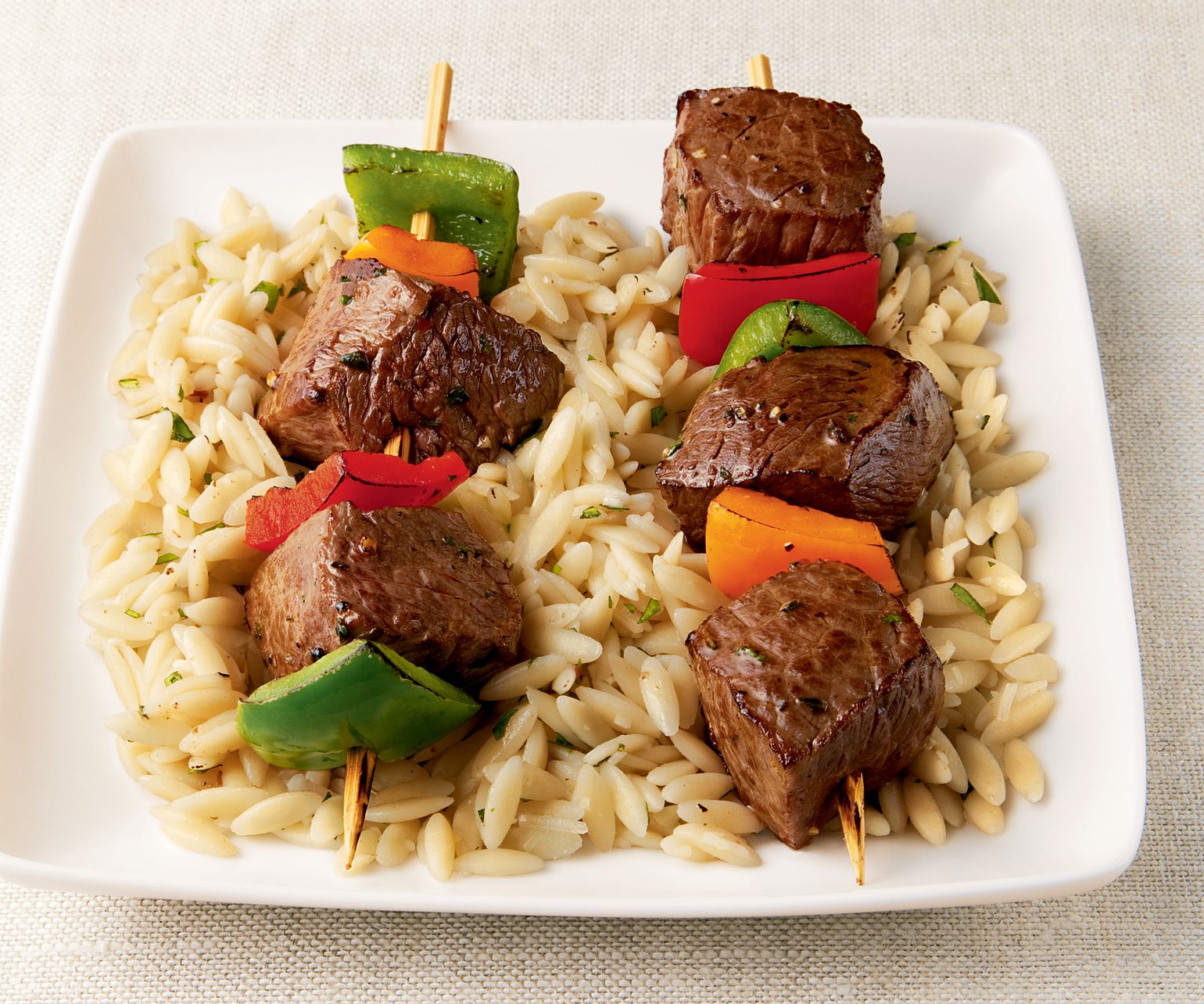 Sizzling Sirloin Kabobs on a Bed of Orzo