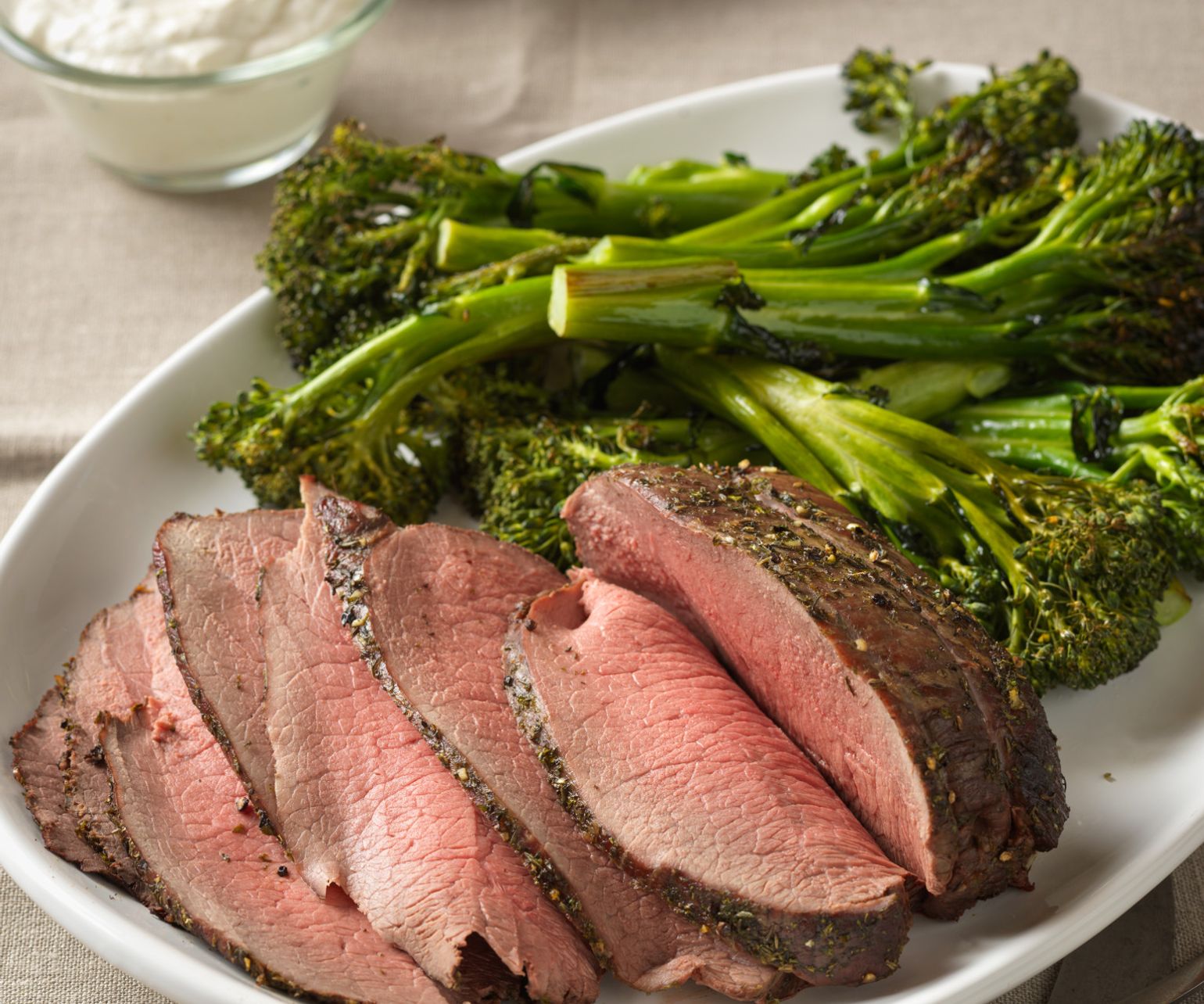 Herb-Crusted Sirloin Tip Roast with Creamy Horseradish-Chive Sauce