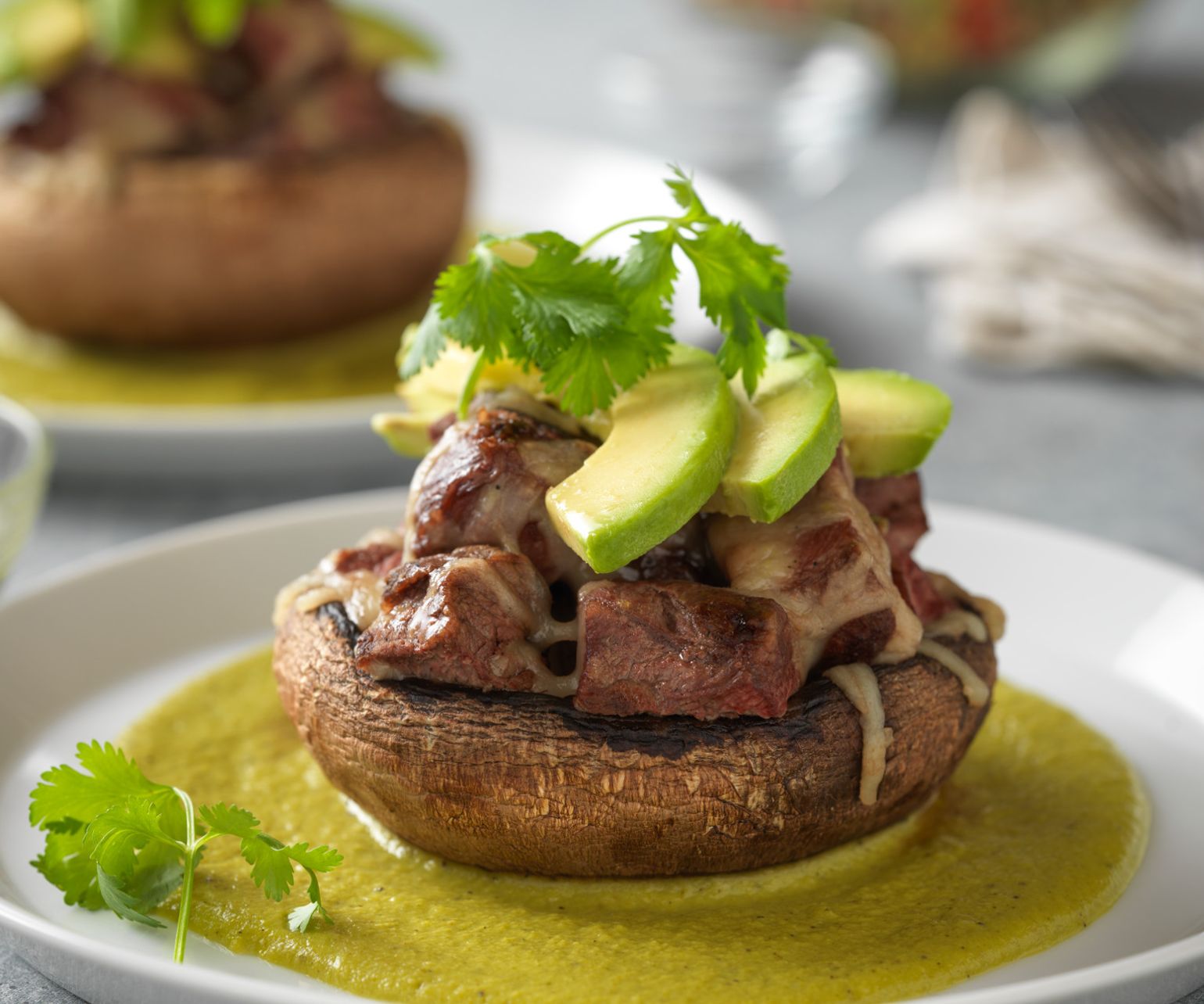 Steak-Stuffed Portobello with Creamy Poblano Sauce