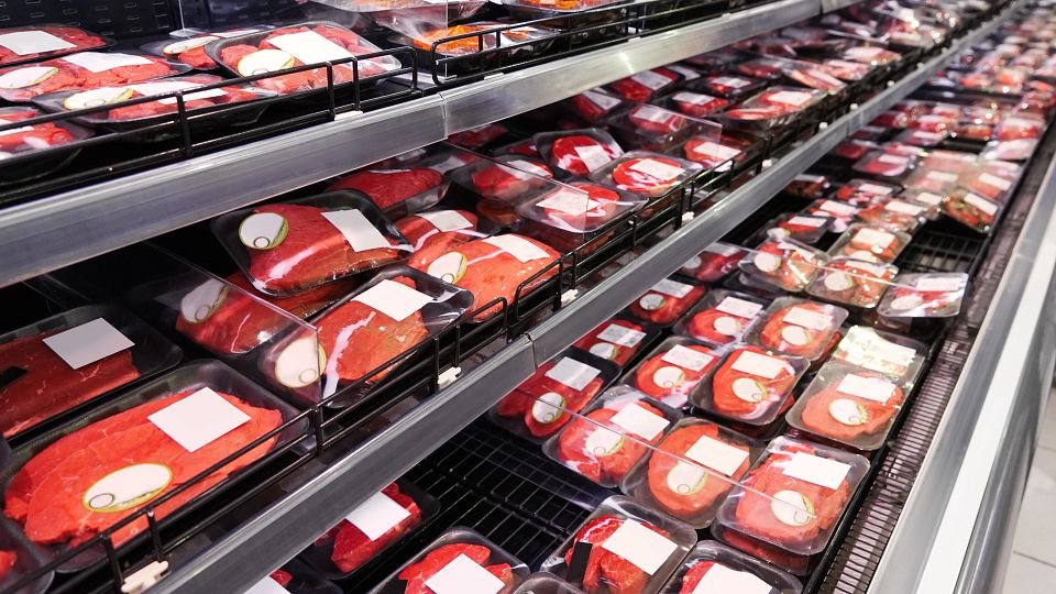 Shelves with fresh meat in supermarket