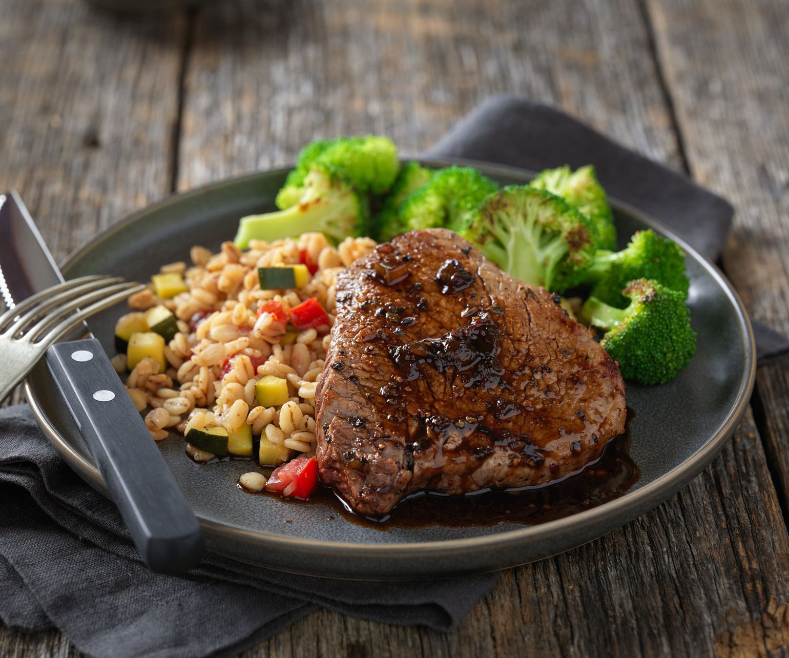 Sweet Spicy Petite Sirloin Steaks with Vegetable Barley Risotto