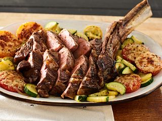 Grilled Cowboy Steak with Parmesan Tomatoes and Cucuzza Squash