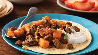 Ground Beef and sweet potato chunks get wrapped up in a whole-wheat tortilla.