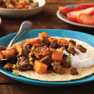 Ground Beef and sweet potato chunks get wrapped up in a whole-wheat tortilla.