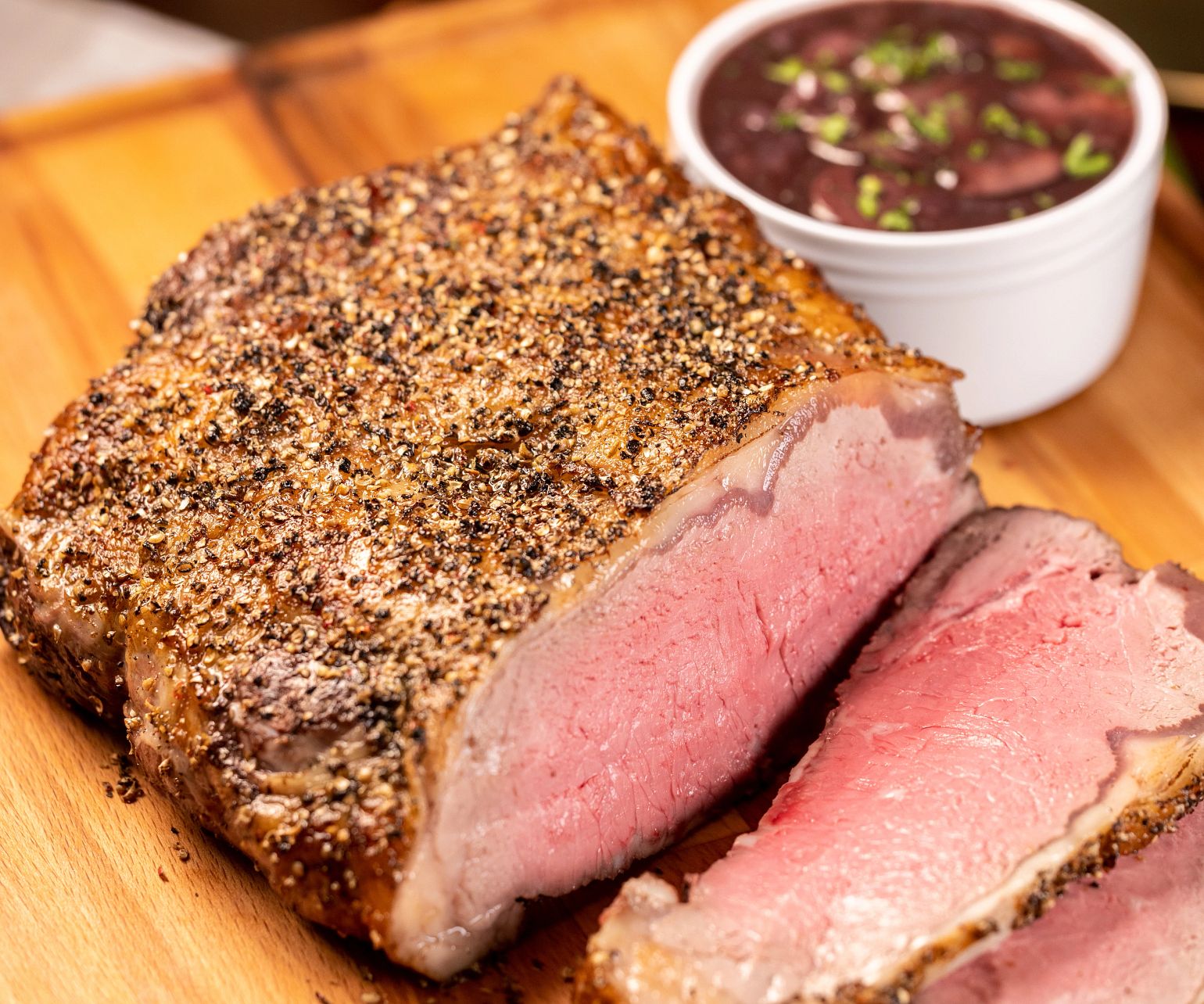 Green Peppercorn Crusted Strip Roast with Red Wine Sauce