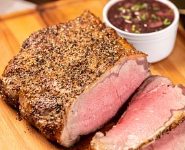 Green Peppercorn Crusted Strip Roast with Red Wine Sauce