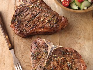 Greek-Seasoned T-Bone Steaks with Cucumber and Tomato Salad