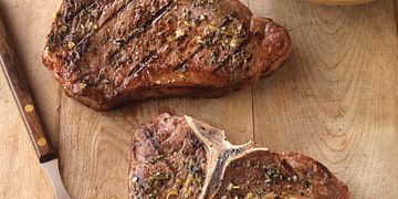 Greek-Seasoned T-Bone Steaks with Cucumber and Tomato Salad