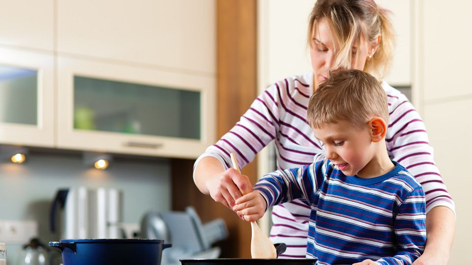 Family cooking in kitchen