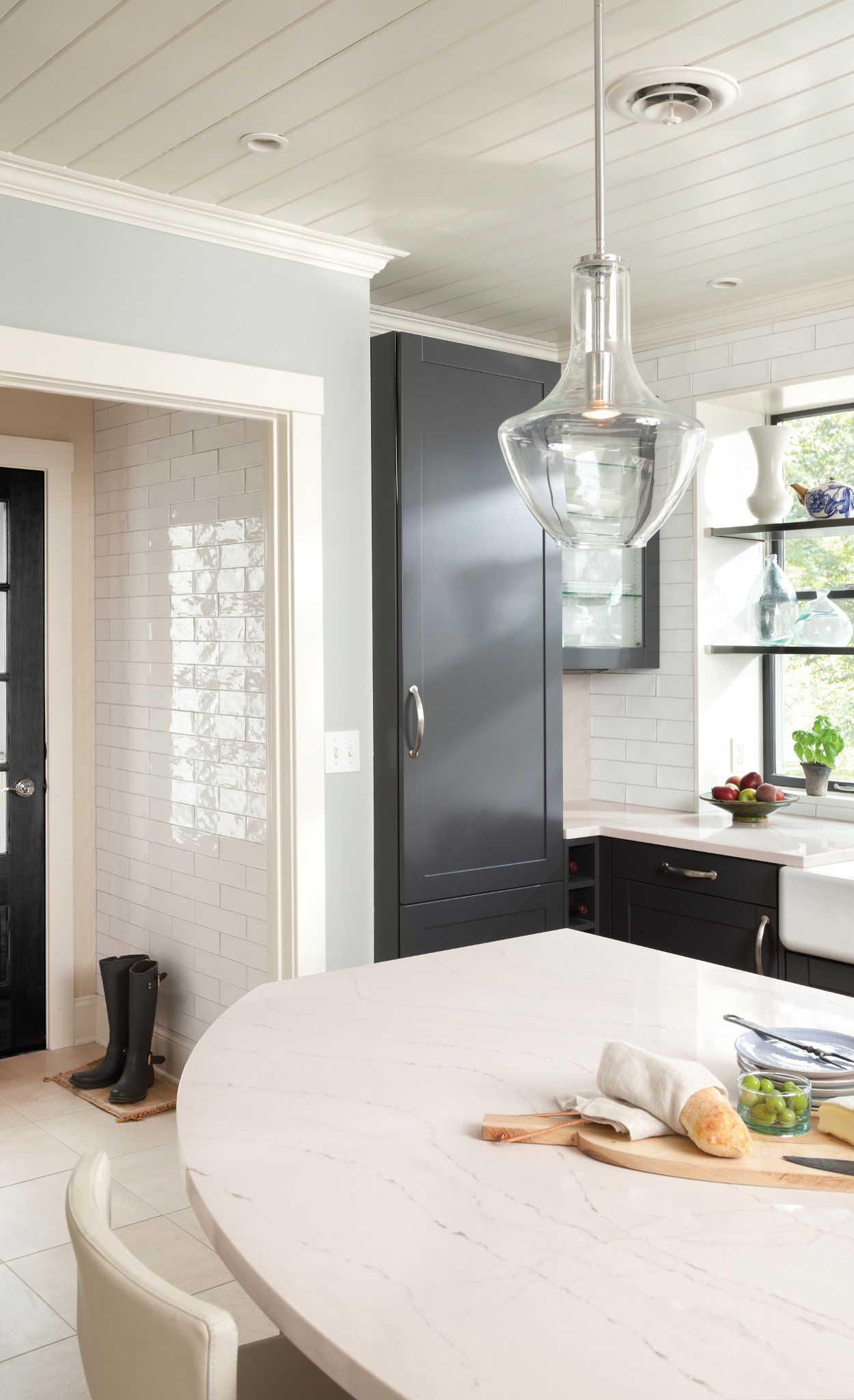 Modern farmhouse kitchen featuring a luxe curved Ella island.