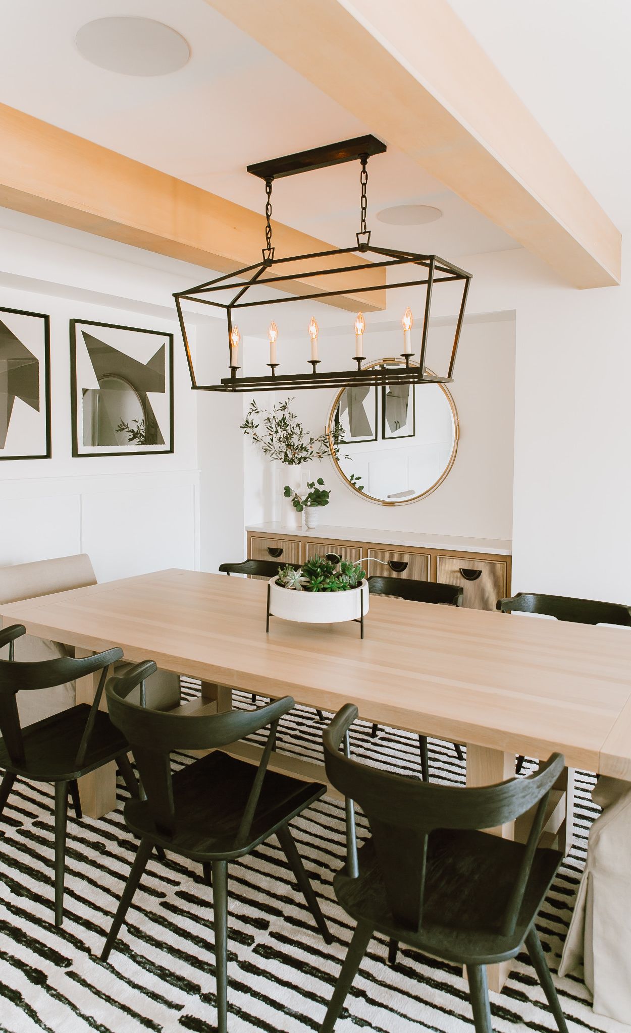 A blonde wood table and cabinet paired with Cambria Ella.