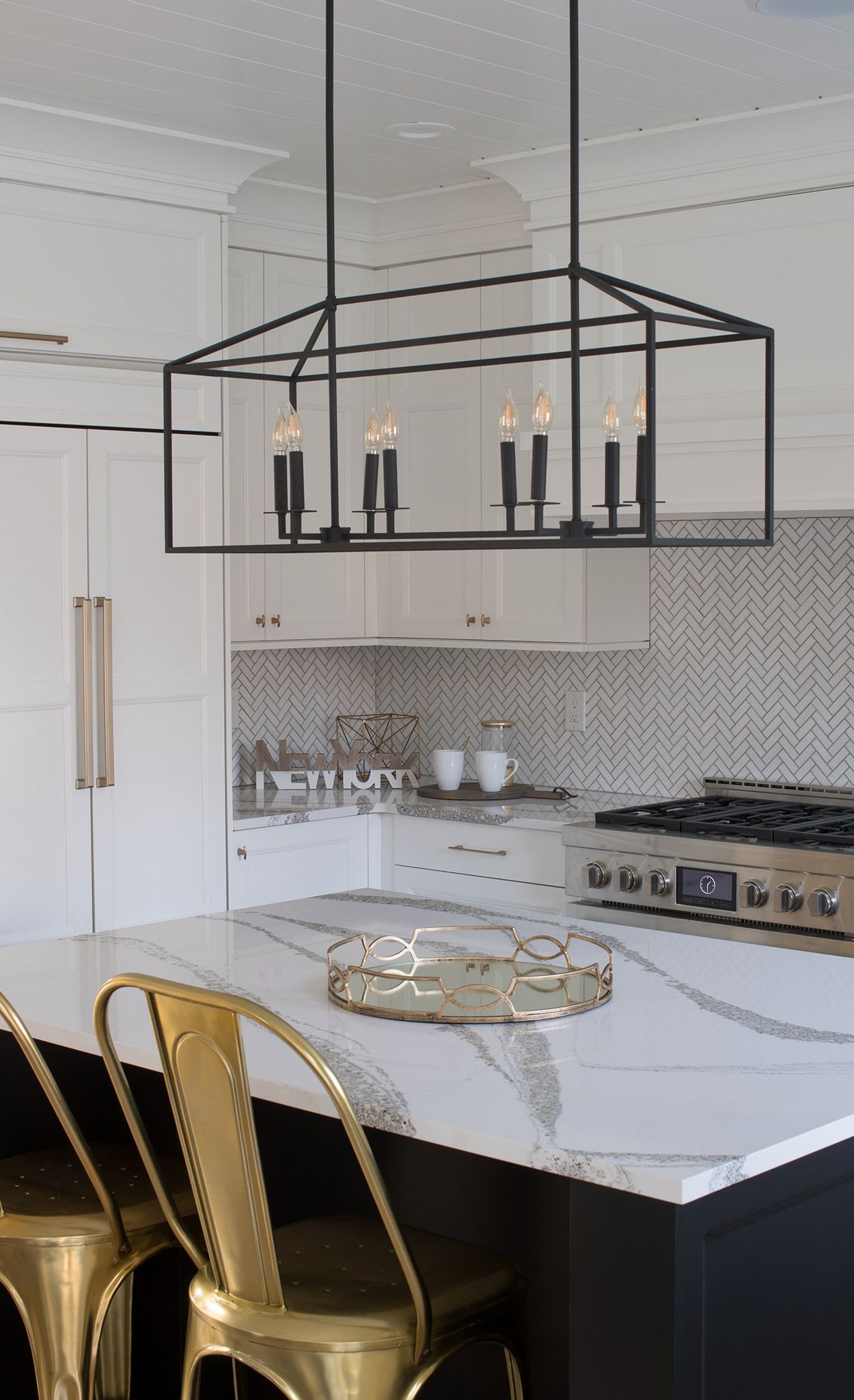 Cambria Anicca paired with white chevron tile backsplash.