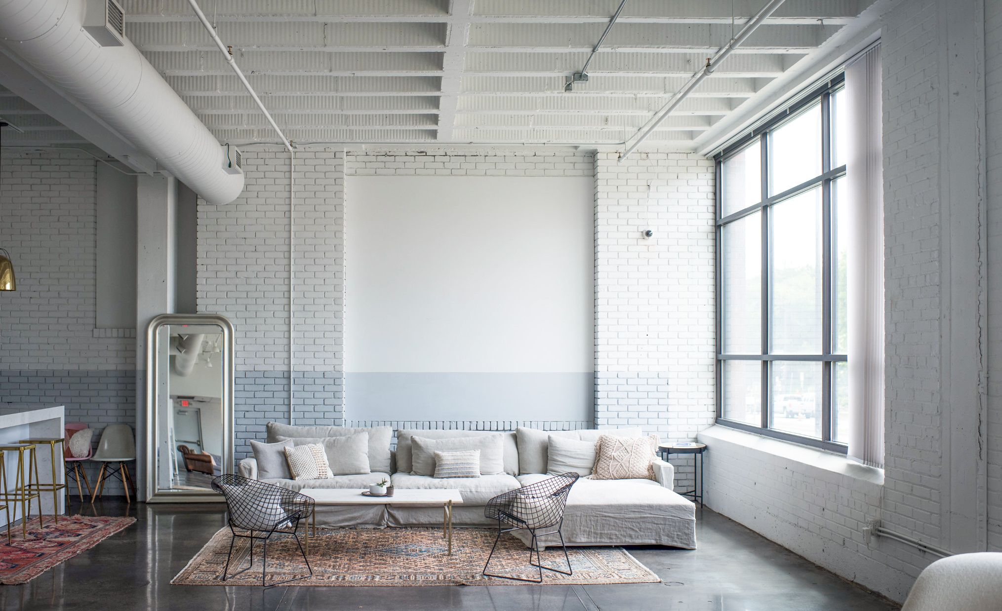 Oversized couch for small meetings or solo work.