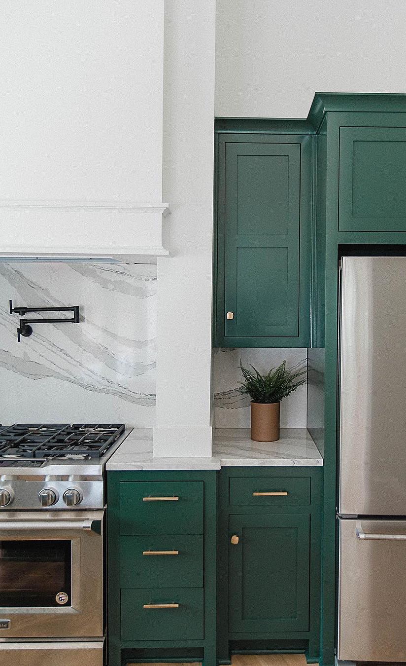 Green farmhouse kitchen with Brittanicca™ countertops.