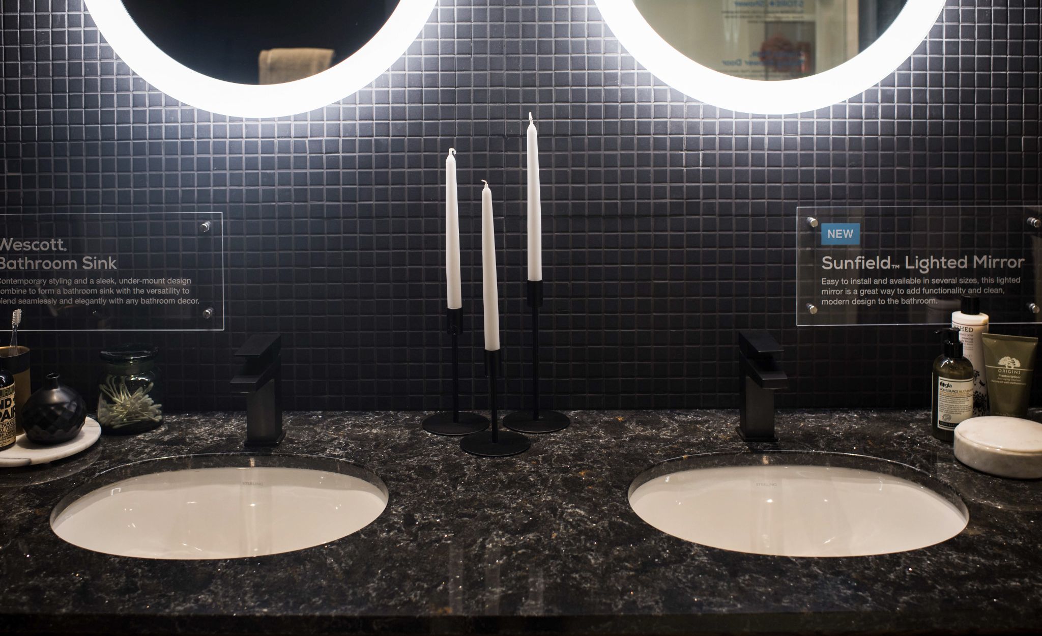 Matte black fixtures paired with dark Cambria Armitage countertops in this vanity.
